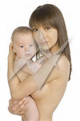 Young naked mother holding and hugging baby boy