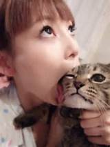 This cute Japanese girl love to lick her cat? Maybe she practices to ...