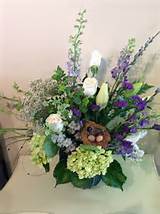 Spring arrangement with birds nest, pussy willows, hydrangeas.