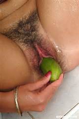 ... tits and toying her hairy pussy with a big fat cucumber in the shower