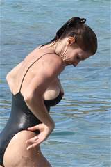 ... nipple-slipping out of her swimsuit while vacationing in St. Barts