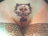 Cat with bow-tie vagina tattoo