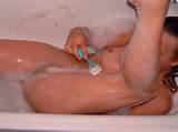 Hot teen girl shaving legs and shaving pussy in bathtub