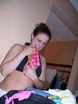 Phot of college gal putting pantyas in her mouth