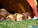 fine lady and her man are sleeping nude in their tent by the ocean