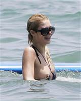 sexy Paris Hilton nip slip in the sea