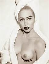 Miley Cyrus goes topless for Vogue Germany Magazine March 2014 Photos