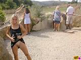 ... blonde girl flashing her pussy with some giraffes in the background